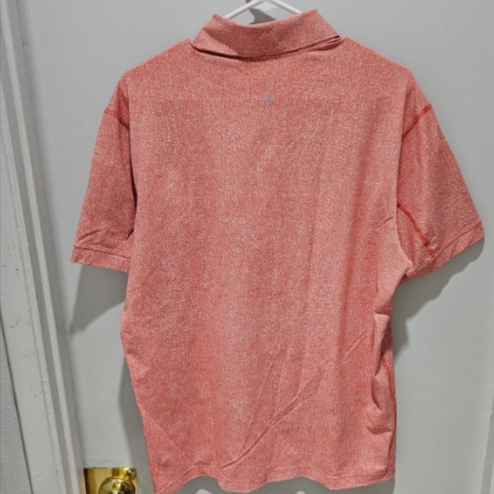 Salmon pink lululemon polo shirt not sure what size it is maybe medium or large